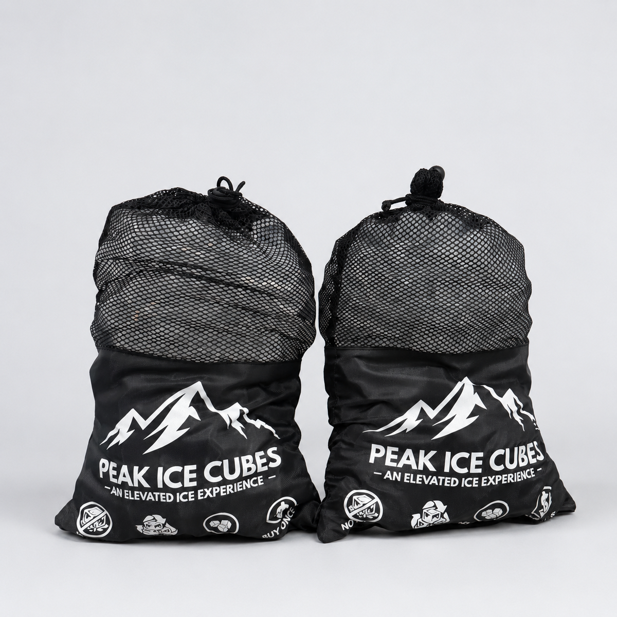 Two bags of PEAK Ice Cubes on a clean studio background
