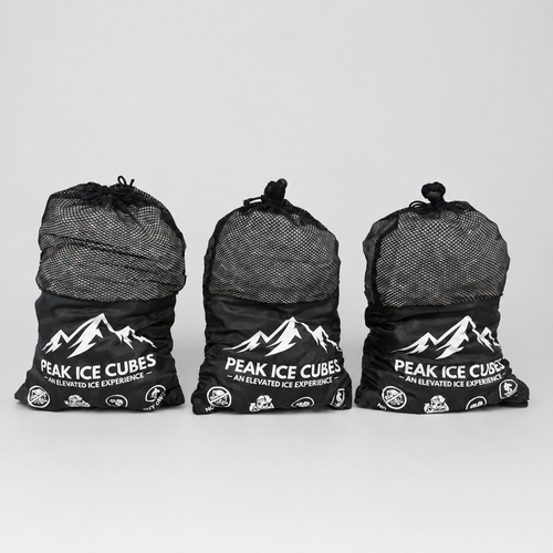 Three bags of PEAK Ice Cubes on a clean studio background